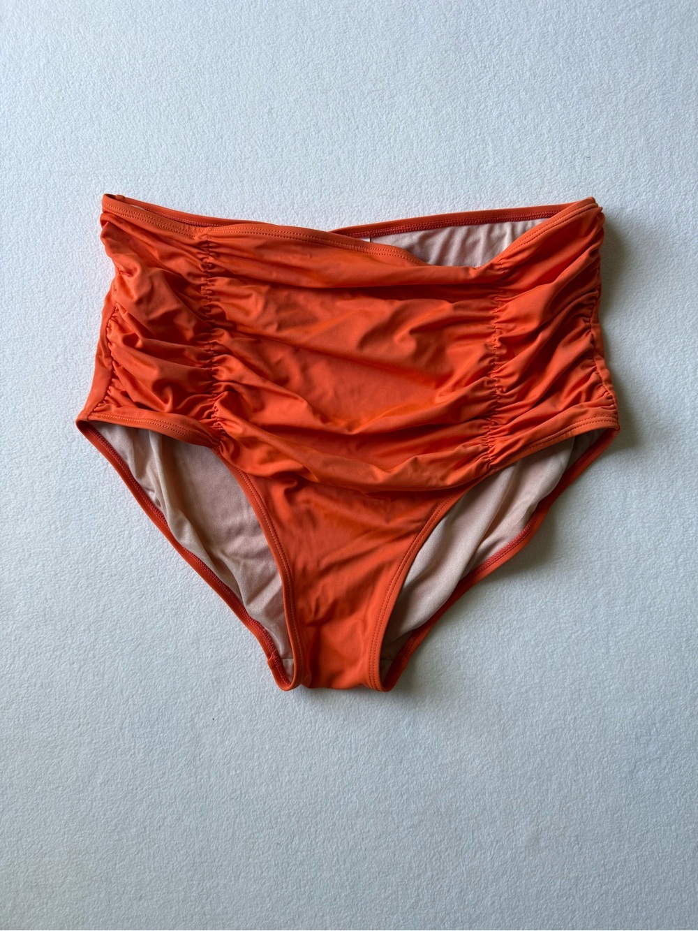 Kortni Jeane High-Waist Ruched Bikini Bottoms in Bright Orange